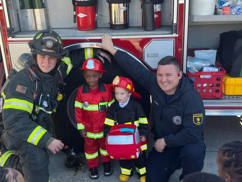 brfd firefighters with children in front of truck