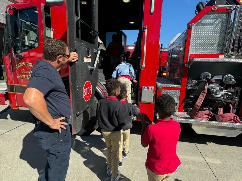 chris moulle children climbing into engine 13
