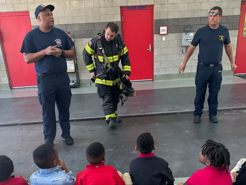 teaching kids fire safety in station 13 engine bay
